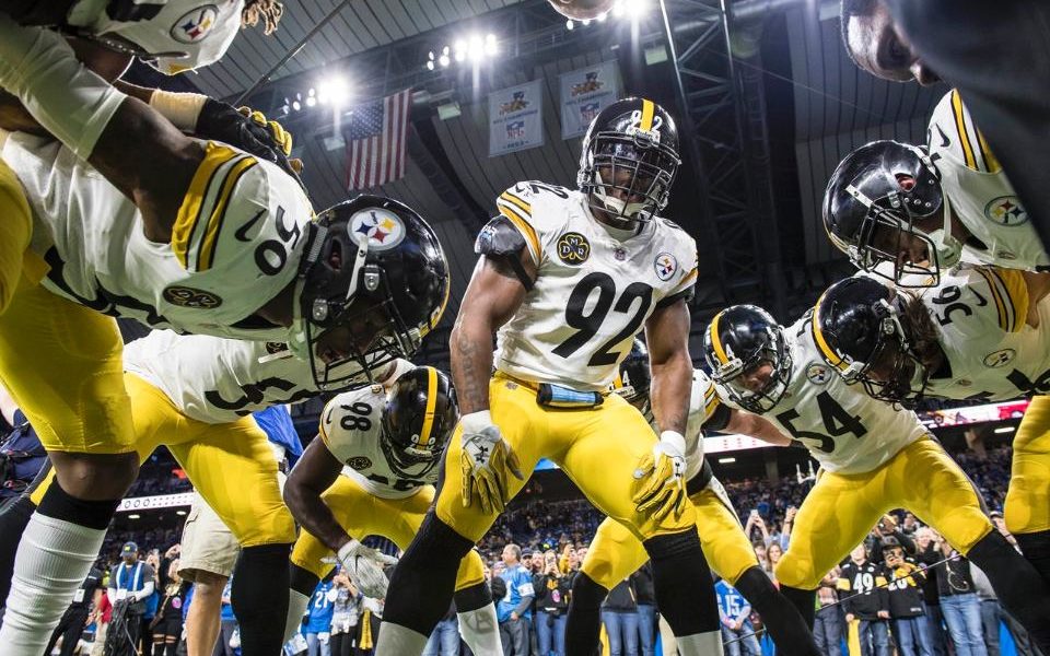 James Harrison #92 leads the Steelers in a pre-game pep talk ahead of playing the Detroit Lions