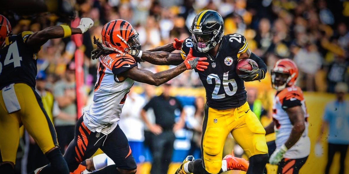 Steelers running back Le'Veon Bell stiff arms Bengals defensive back Dre Kirkpatrick