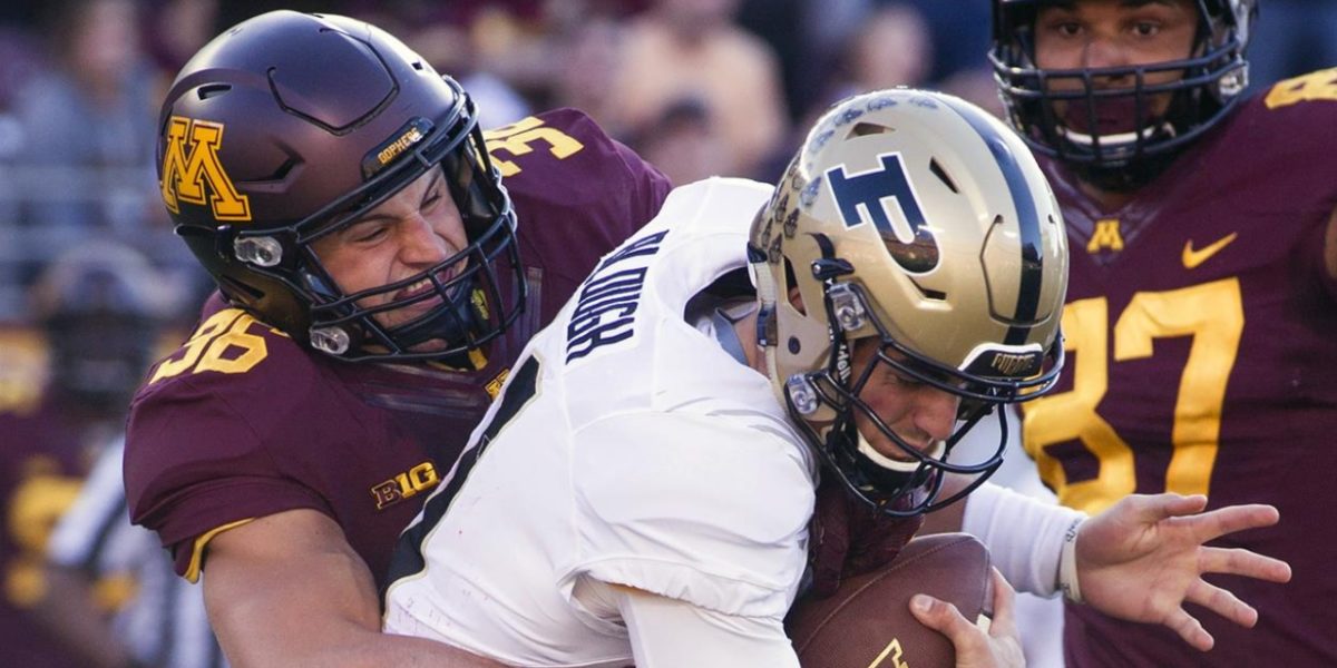 Minnesota Golden Gophers linebacker Blake Cashman makes a sack against the Purdue Boilermakers