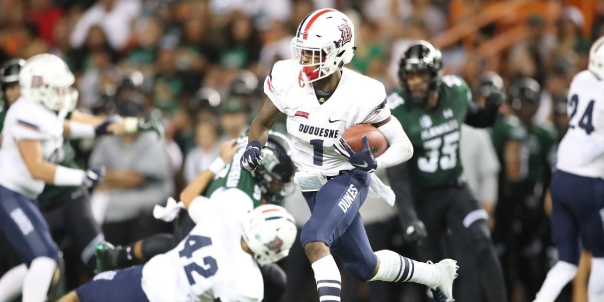 Duquesne University receiver Nahari Crawford runs a catch for a touchdown