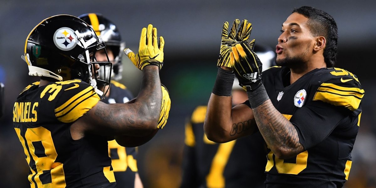 Pittsburgh Steelers running backs James Conner and Jaylen Samuels celebrate on the sidelines