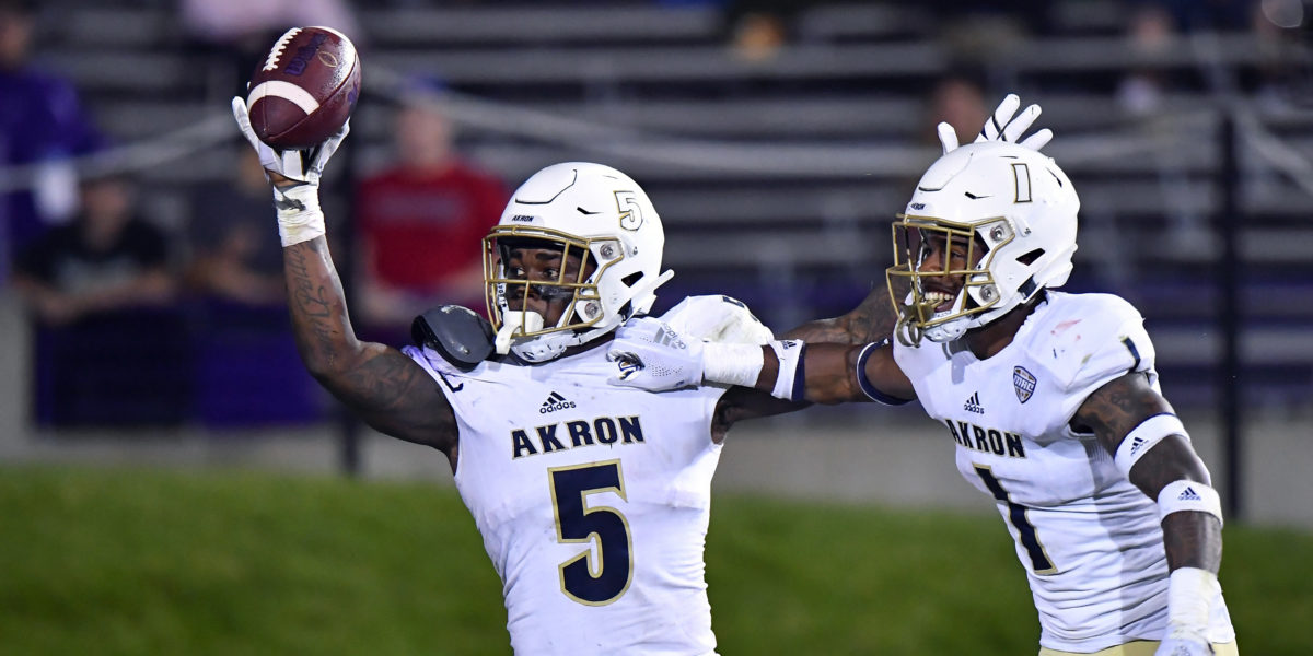 Akron Zips linebacker Ulysees Gilbert III (5) react after scoring a touchdown on a fumble recovery in the second half against the Northwestern Wildcats at Ryan Field. Mandatory Credit: Quinn Harris-USA TODAY Sports