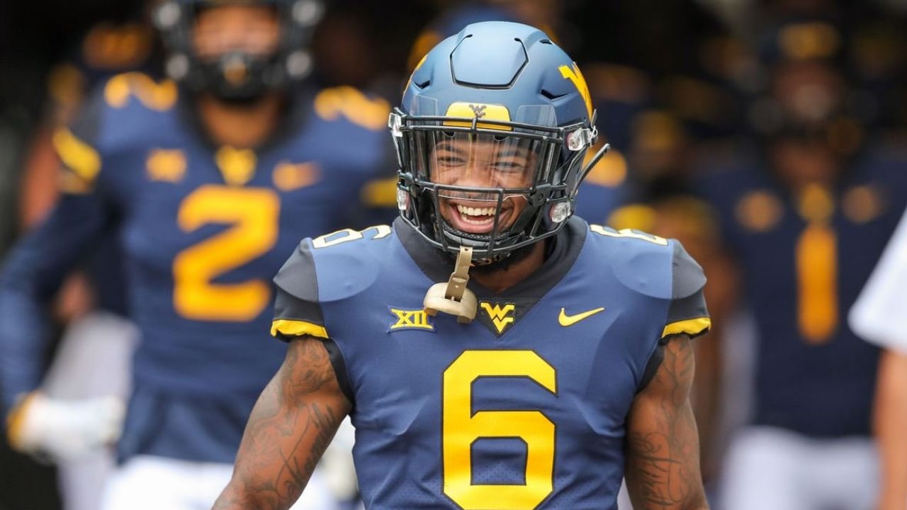 West Virginia Mountaineers safety Devon Askew-Henry runs onto the field before a game in 2018