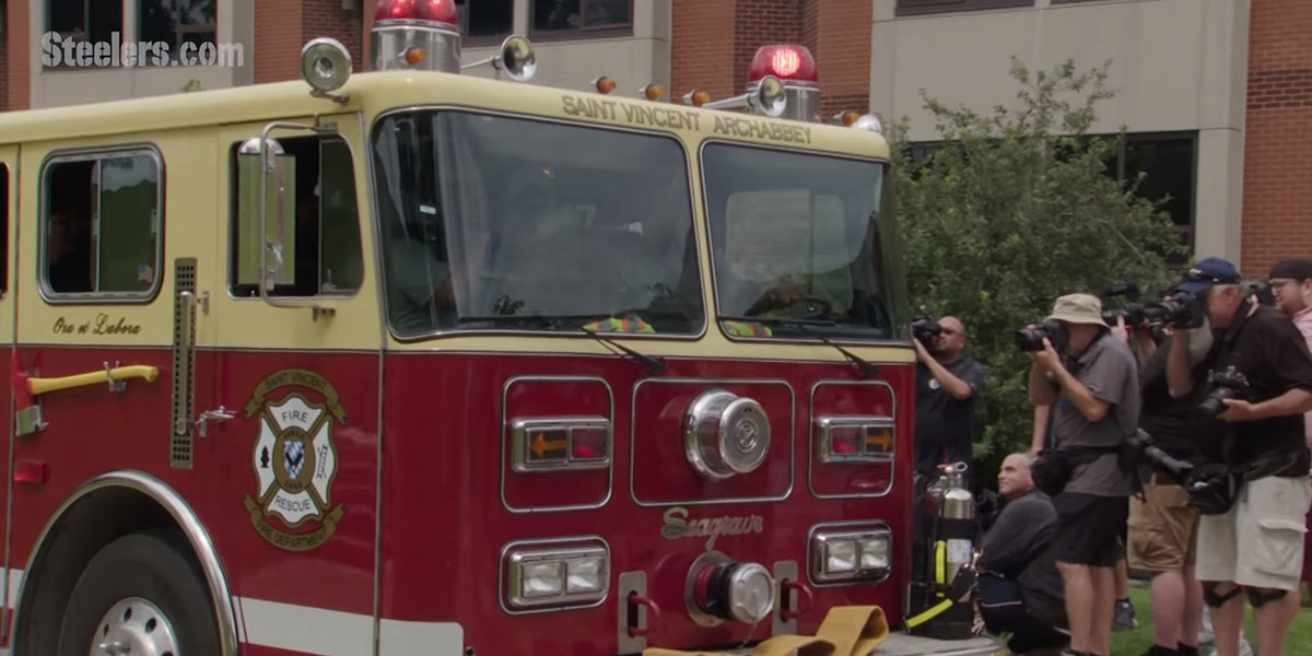 James Harrison arrives to training camp on a fire truck