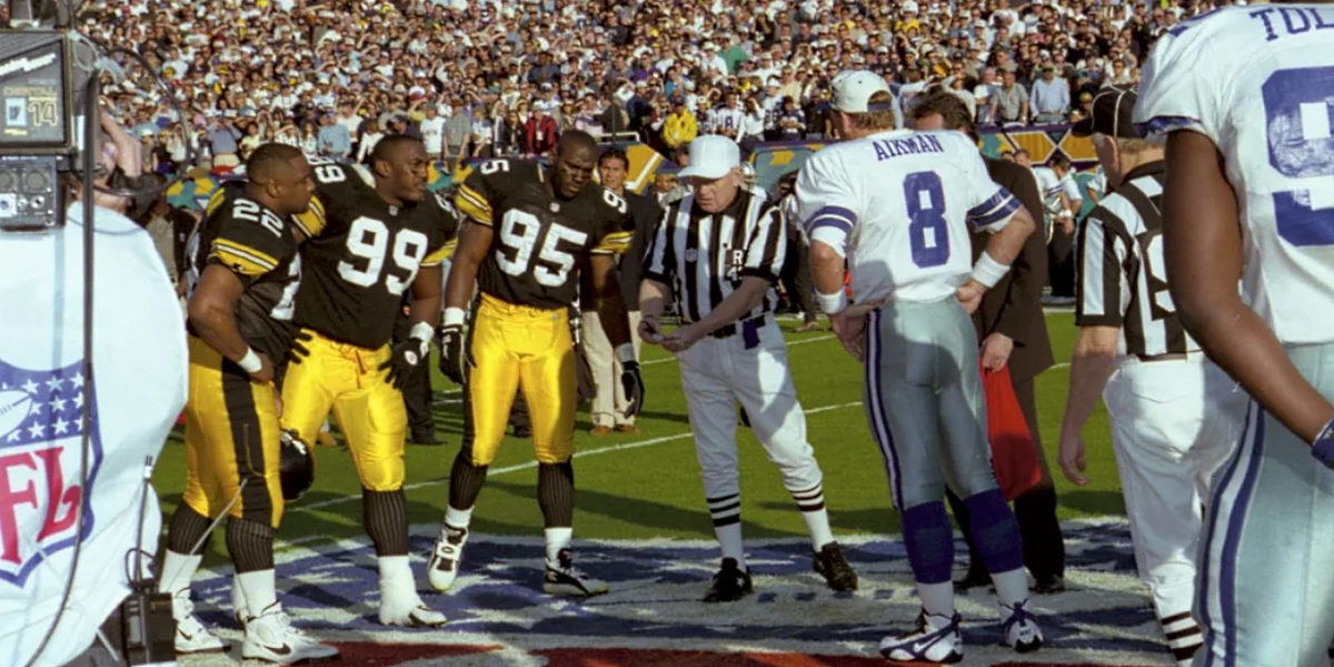 The Pittsburgh Steelers and Dallas Cowboys prepare for the coin toss to open Super Bowl XXX