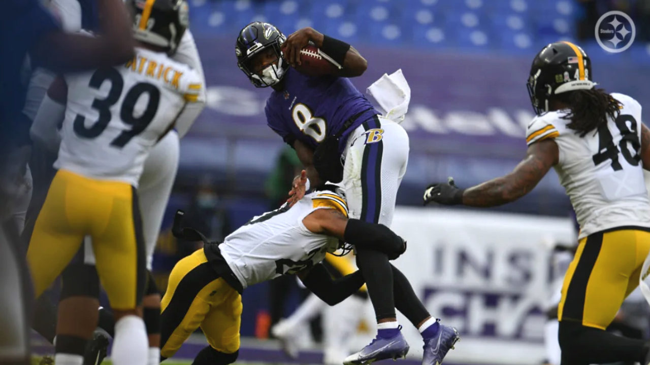 Cameron Sutton of the Pittsburgh Steelers tackles Lamar Jackson of the Ravens