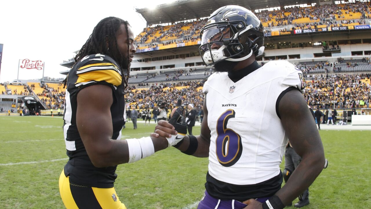 Pittsburgh Steelers running back Najee Harris (22) and Baltimore Ravens linebacker Patrick Queen (6)