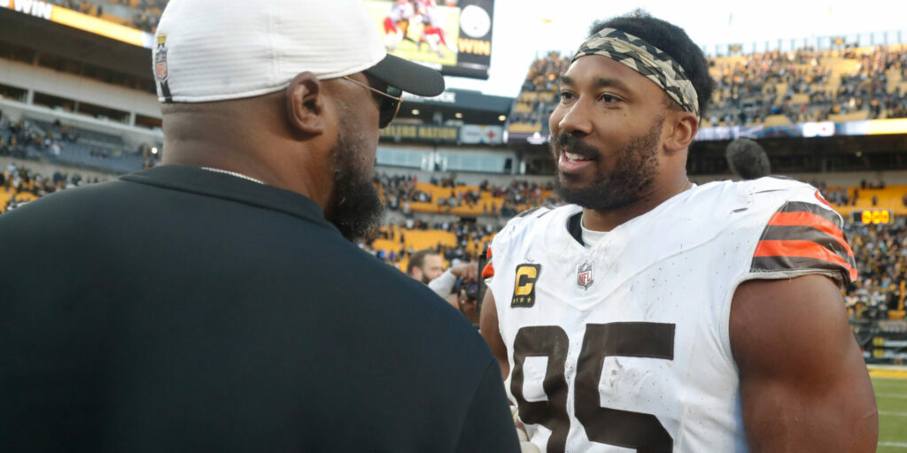 Pittsburgh Steelers head coach Mike Tomlin (left) and Cleveland Browns defensive end Myles Garrett (95)